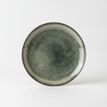 Muschio reactive-glaze ceramic plate in mottled mossy green-grey with dark rim, on white