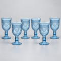 Set of six smoky blue embossed plastic goblets on a neutral studio background