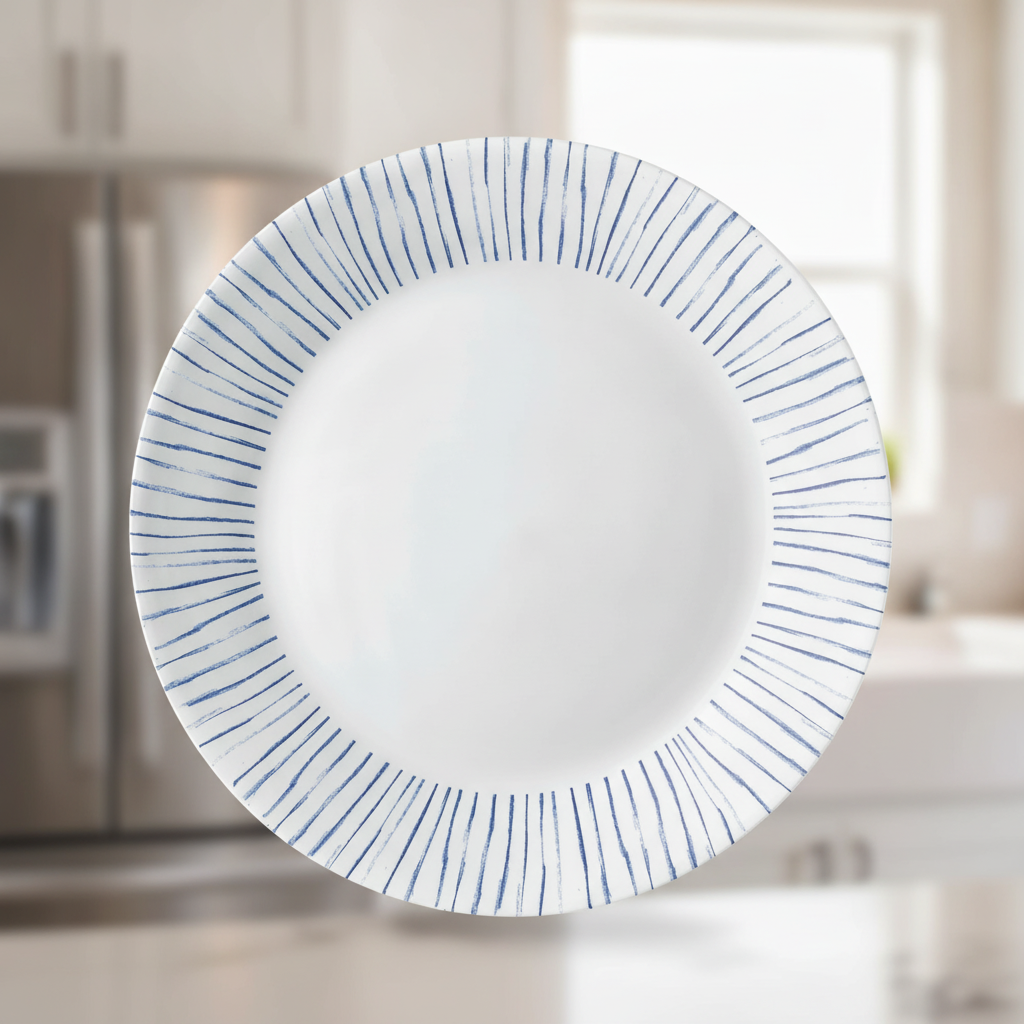 Close-up of the thin glass edge and indigo radial brushstroke stripes on a dinner plate
