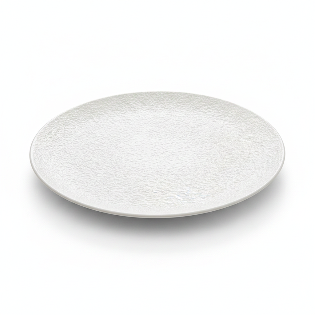 Martellato matte-white hammered-texture ceramic coupe dinner plate on white