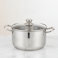 Polished 304 stainless steel stockpot with glass lid on a marble countertop