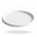 Riva shallow flat coupe porcelain plate with thin stone-textured rim, white studio packshot