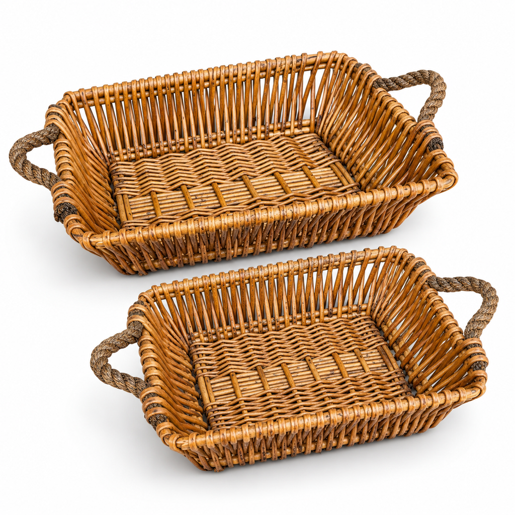 Two natural willow baskets on white.