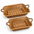 Two natural willow baskets on white.