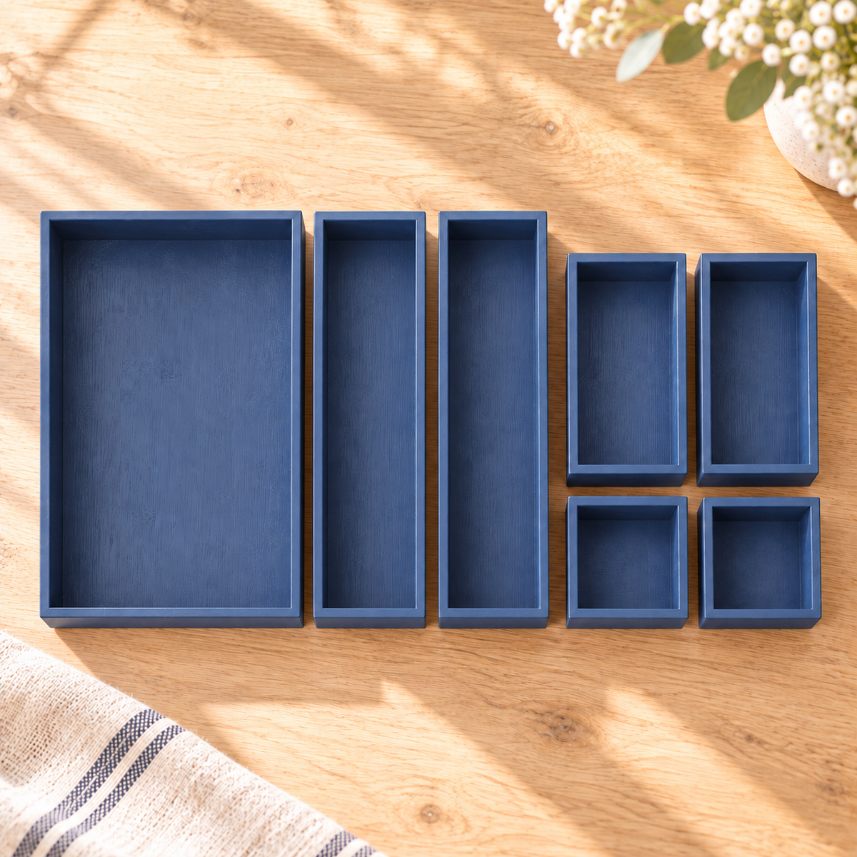 Navy bamboo drawer organizer from a seven-piece set in a bright alternate product view