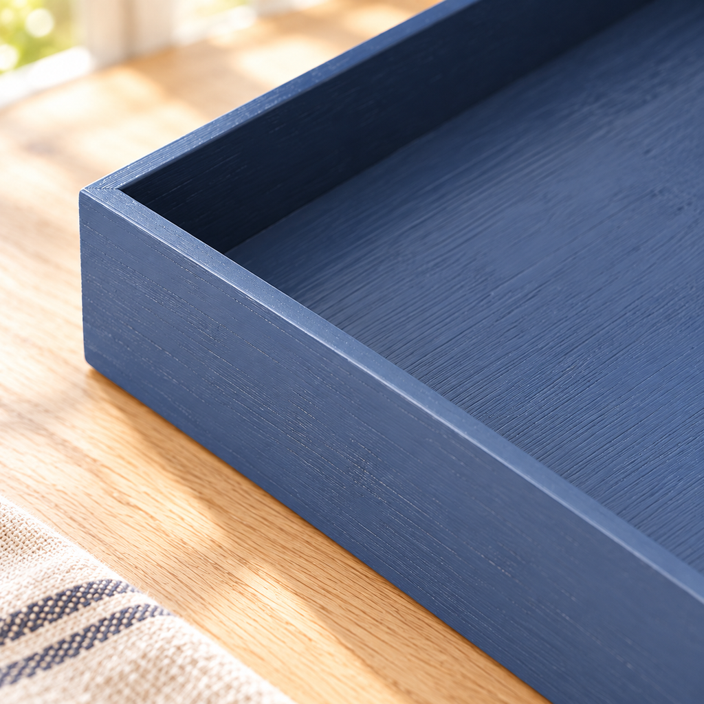 Close-up of navy bamboo drawer organizer from a seven-piece set showing its surface and construction