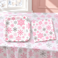 Representative pink snowflake plates and napkins from the 102-piece set; not all pieces shown. Background styling is not included.