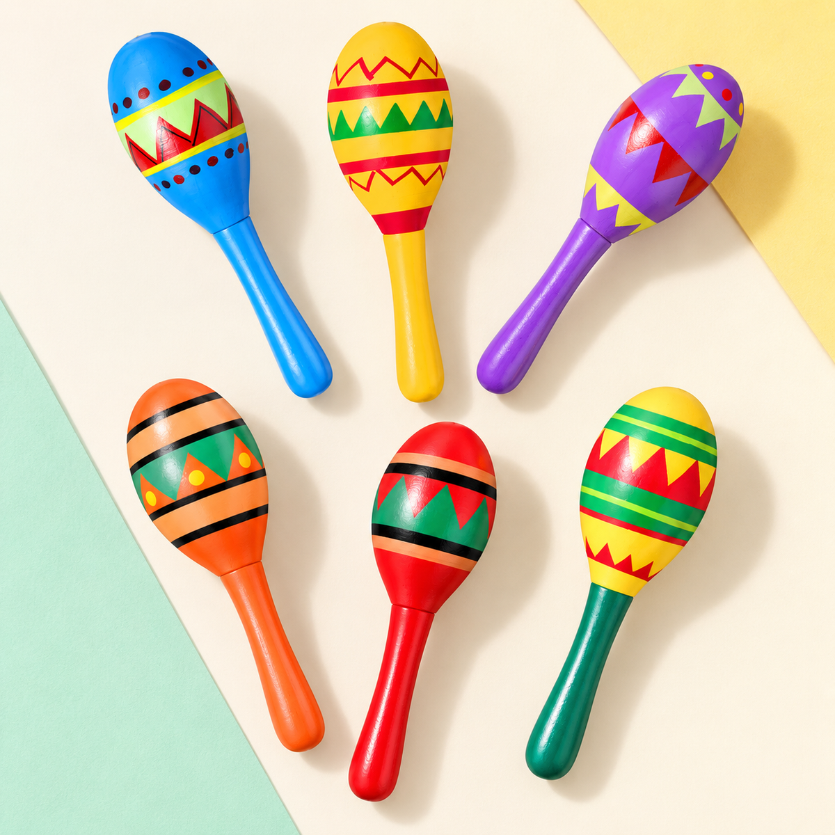 Six representative colorful mini fiesta maracas from the 24-pack; not all pieces shown. Background styling is not included.