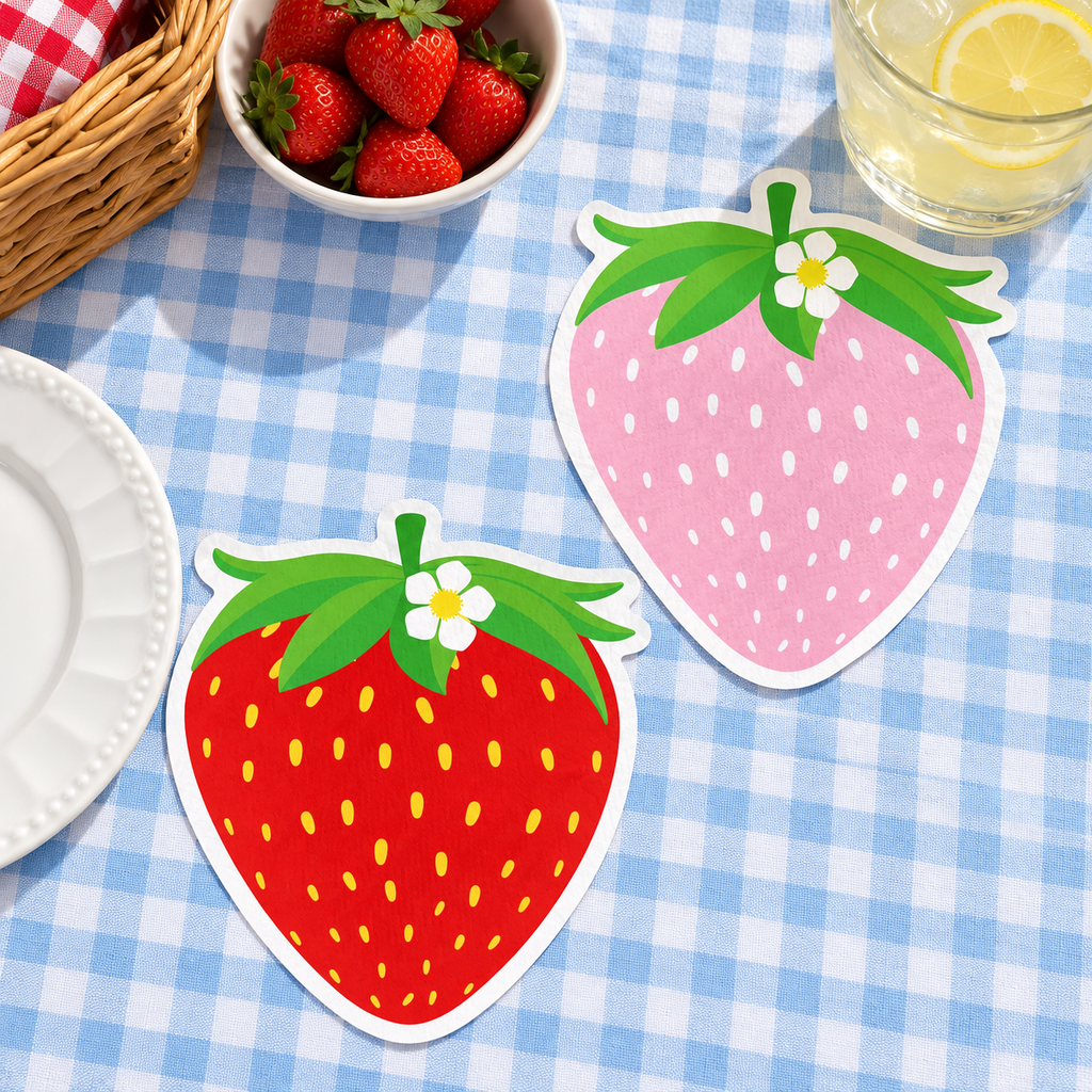Representative red and pink strawberry-shaped napkins at a picnic; food, drink and styling props are not included.