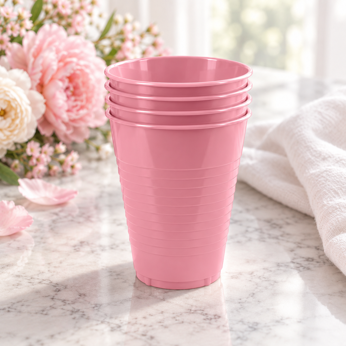 A short nested stack of pink plastic cups showing rim spacing and grip bands. Background styling is not included. Representative selection from the pack.
