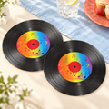 Two representative record-shaped paper napkins from the 100-pack; food, glassware and styling props are not included.