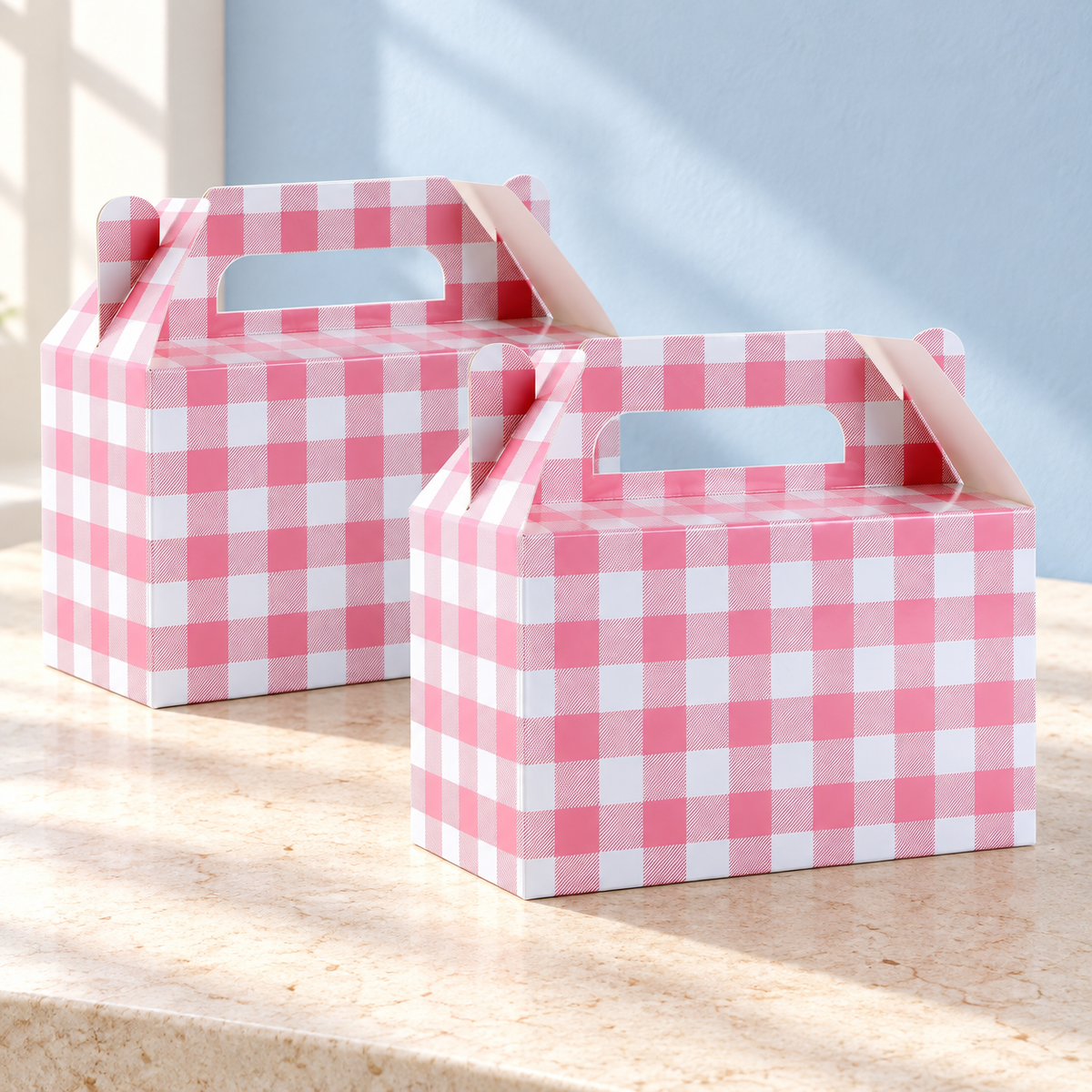 Two representative pink gingham favor boxes from the 12-pack; not all boxes shown. Background styling is not included.