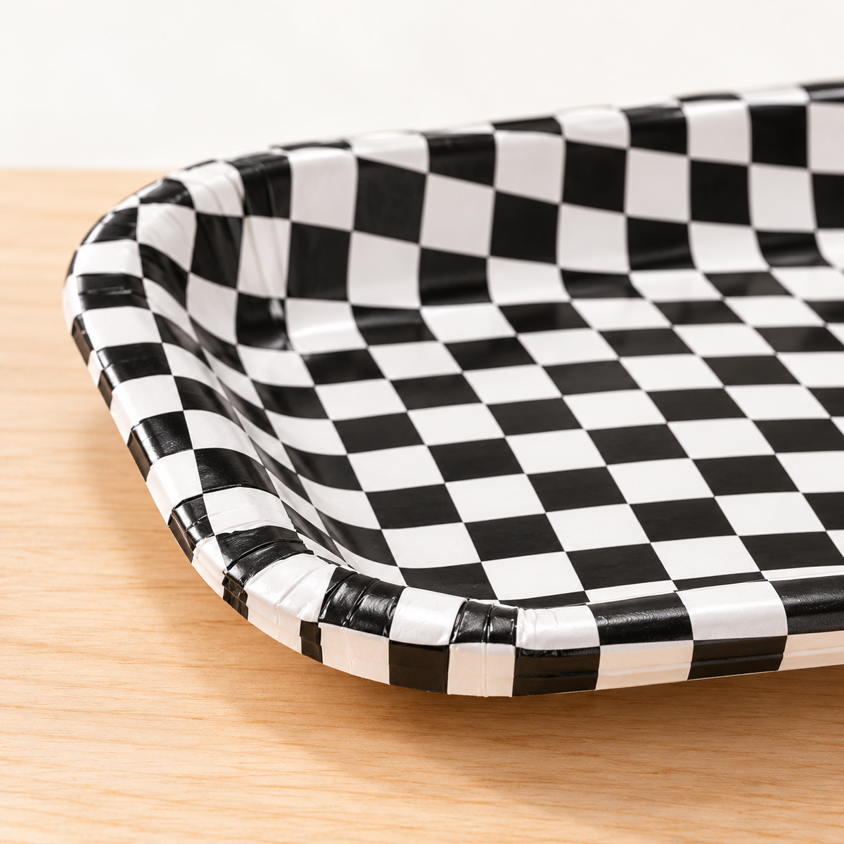 Close-up of the rounded corner, shallow rim and paper construction of the race-check tray.