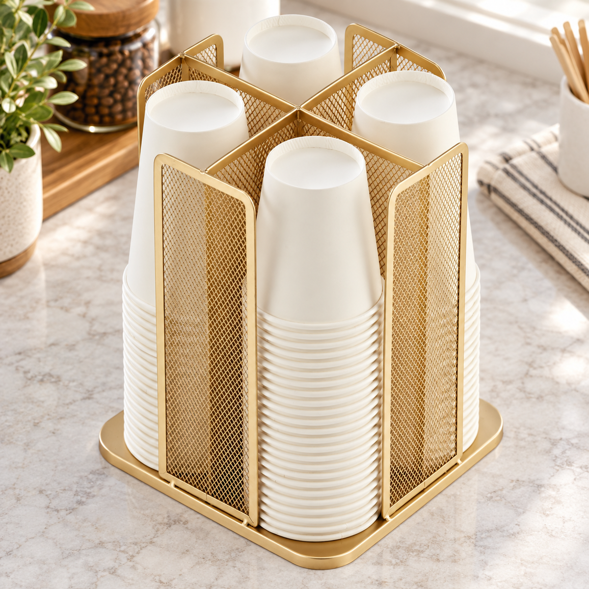 High-angle view of four filled compartments and the central crossed dividers; organizer only, cups are styling props.