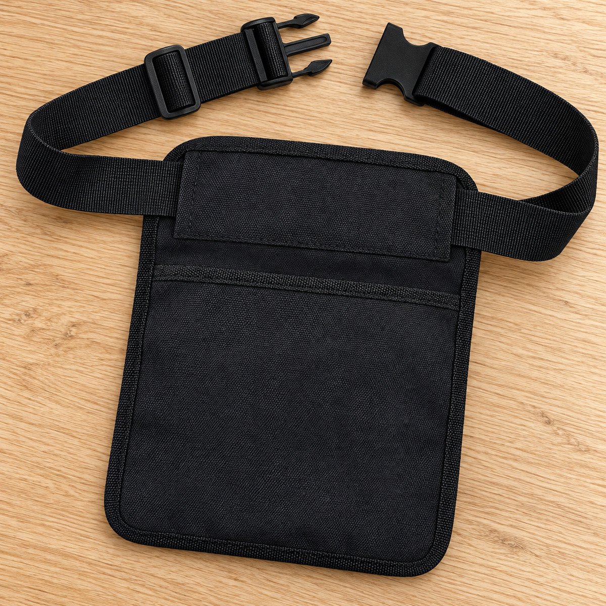Back of the black server waist pouch and its attached belt, matching the original construction.