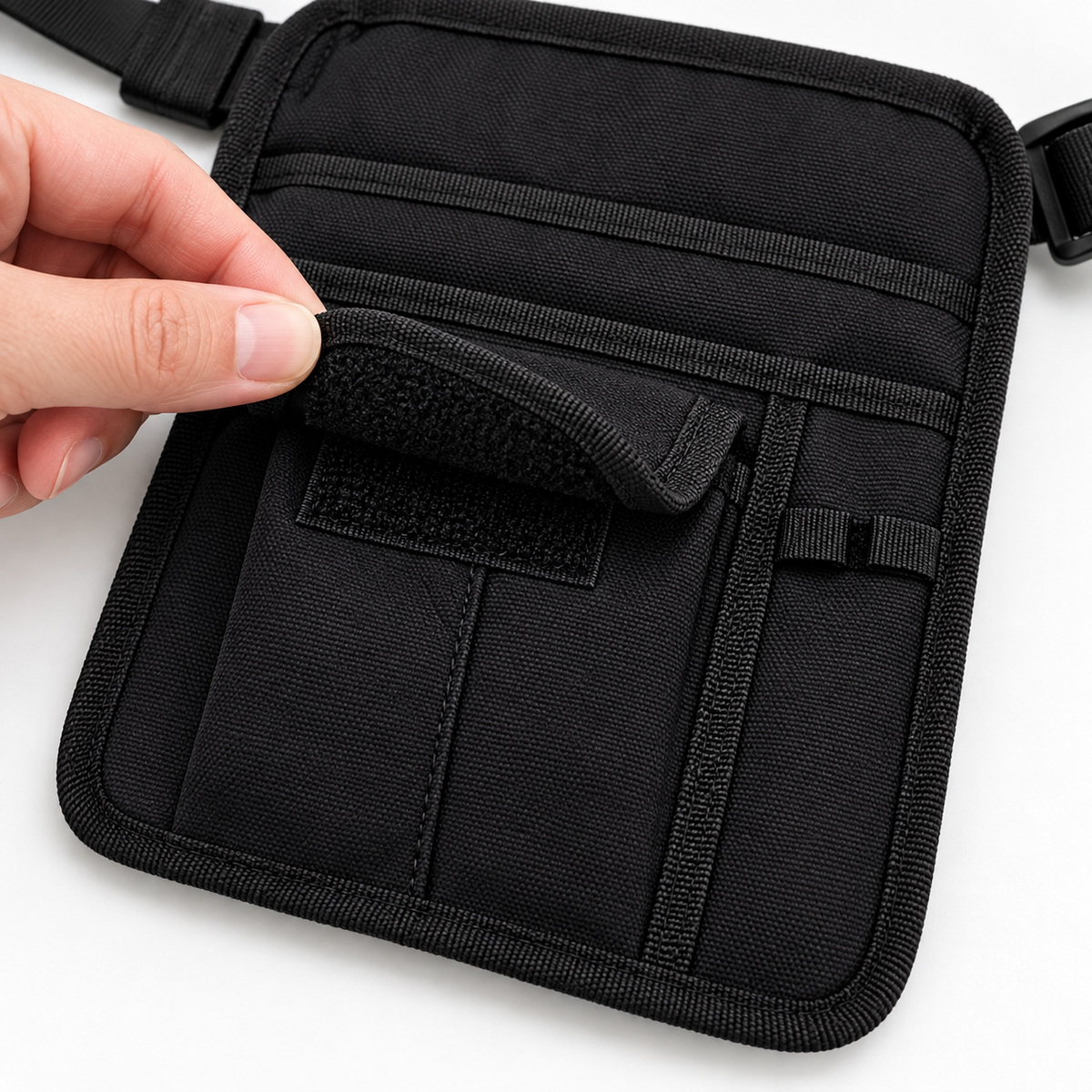 Detail of the server pouch front flap pocket and hook-and-loop closure.