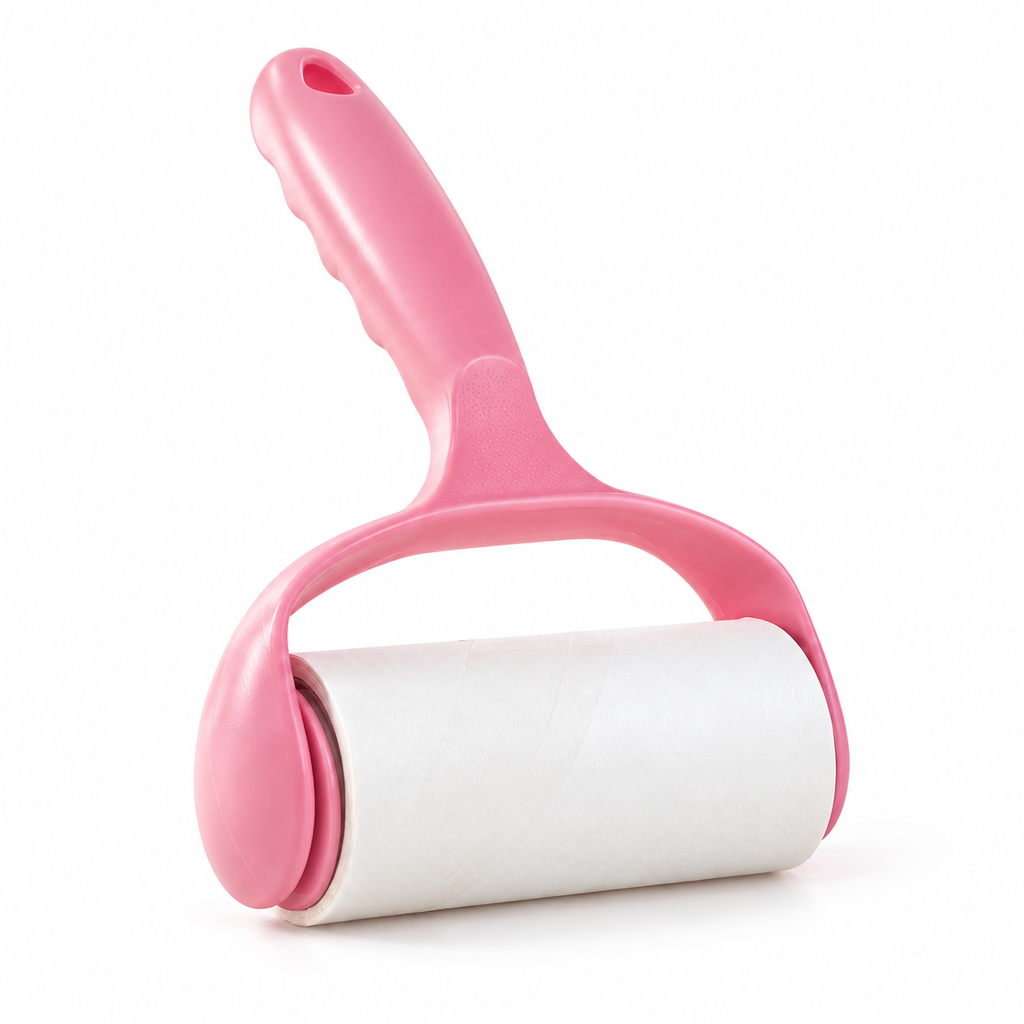 Pink lint roller with one loaded white adhesive-paper roll on white, showing its molded handle, arched support and rounded end caps. The selected option includes one handle and two rolls; the extra roll is not shown.