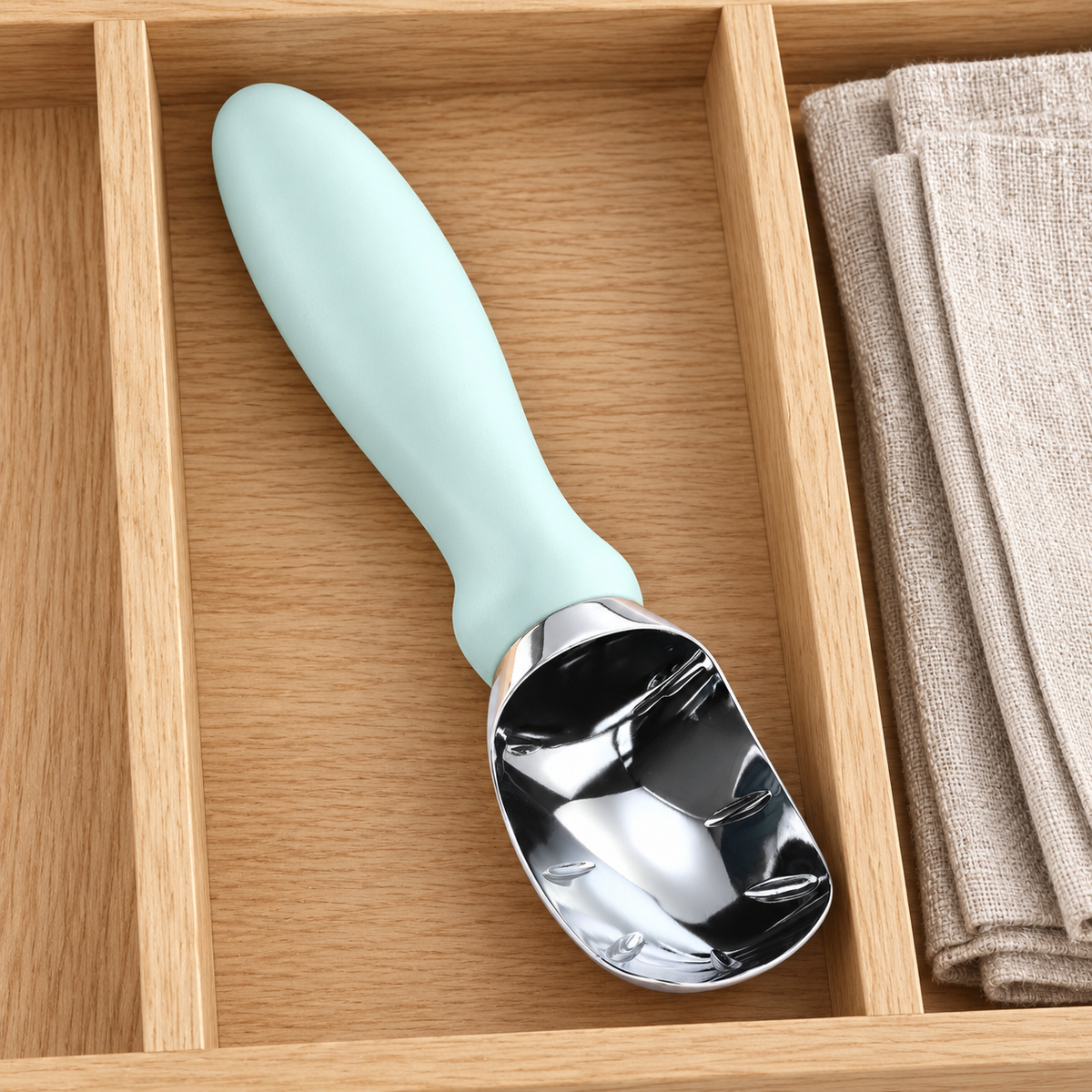 Pale blue-handled scoop in a drawer; one selected-color scoop, accessories not included.