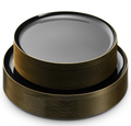 Glossy black plates in two sizes with thin gold outer rims. Representative selection from the pack; styling props not included.
