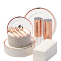 White partyware source arrangement with broad rose-gold-rim plates, clear rimmed cups, rose-gold cutlery and original geometric-border napkins. Representative arrangement; styling props not included.