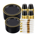 Black and gold two-ring plate stacks, dark gold-rim cup stacks and white-and-gold wrapped cutlery on white. Representative arrangement; styling props not included.