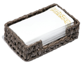 Bark Brown plastic-wicker guest towel tray with a lowered front notch and a stack of white and gold guest towels shown as props on white. Guest towels and styling props not included.