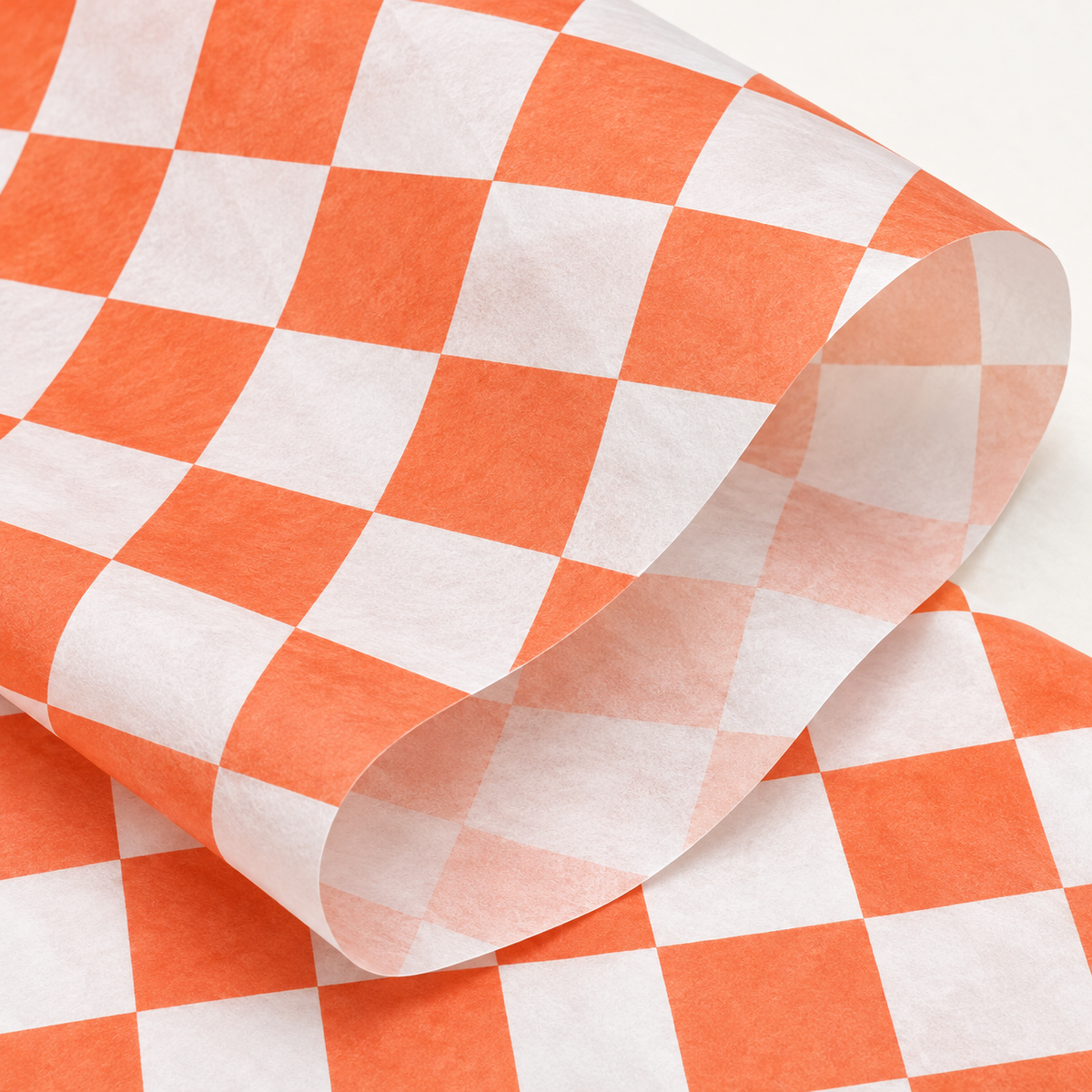 Orange and white check tissue paper, detail photograph, SKU B0DCBSMWY4. Representative sheets from 100-sheet pack; styling not included.