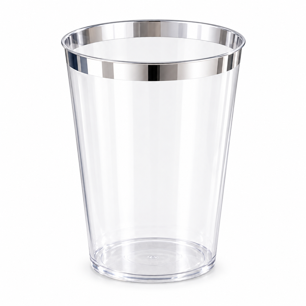 Single empty clear tapered plastic party cup with a narrow metallic silver rim against white.