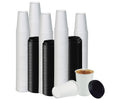 White paper cups and black sipping lids arranged on a white background. Beverages and styling props not included.