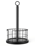 Black paper-towel holder with wood base, wire basket and top ring on white.