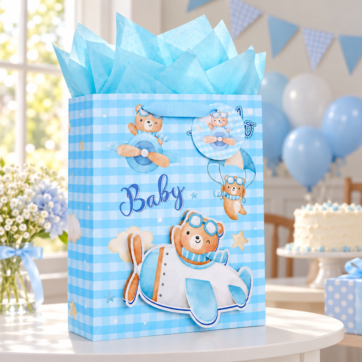 Blue baby gift bag in a pale blue birthday party setting; decorations are styling props.