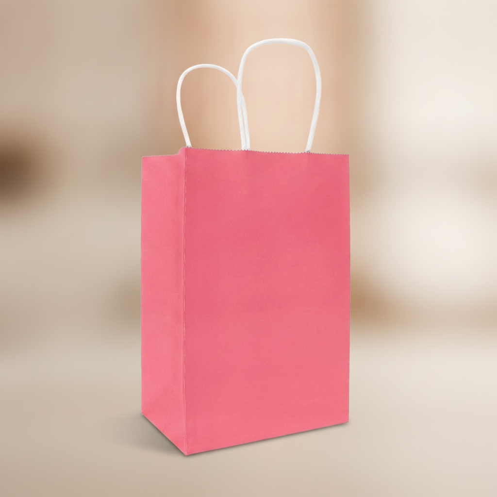 Close-up of pink kraft gift bag texture and white twisted paper handle