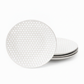 Set of four embossed honeycomb white porcelain salad plates on white