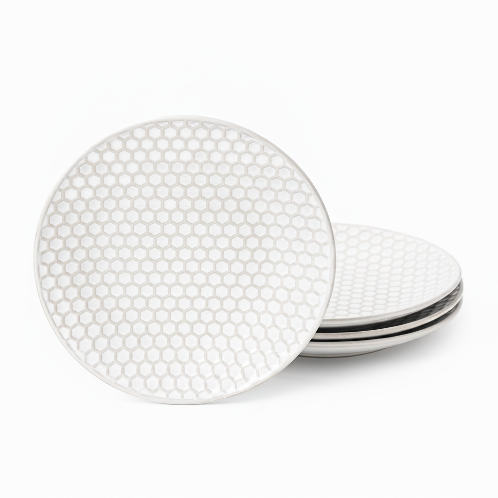 Set of four embossed honeycomb white porcelain salad plates on white