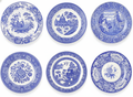 Set of six blue and white transferware earthenware plates on white