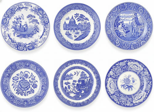 Set of six blue and white transferware earthenware plates on white