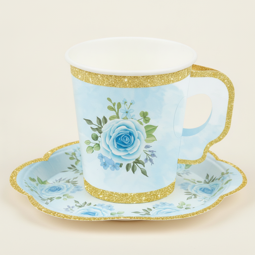 Macro of a floral paper tea cup and scalloped saucer with gold-glitter edge