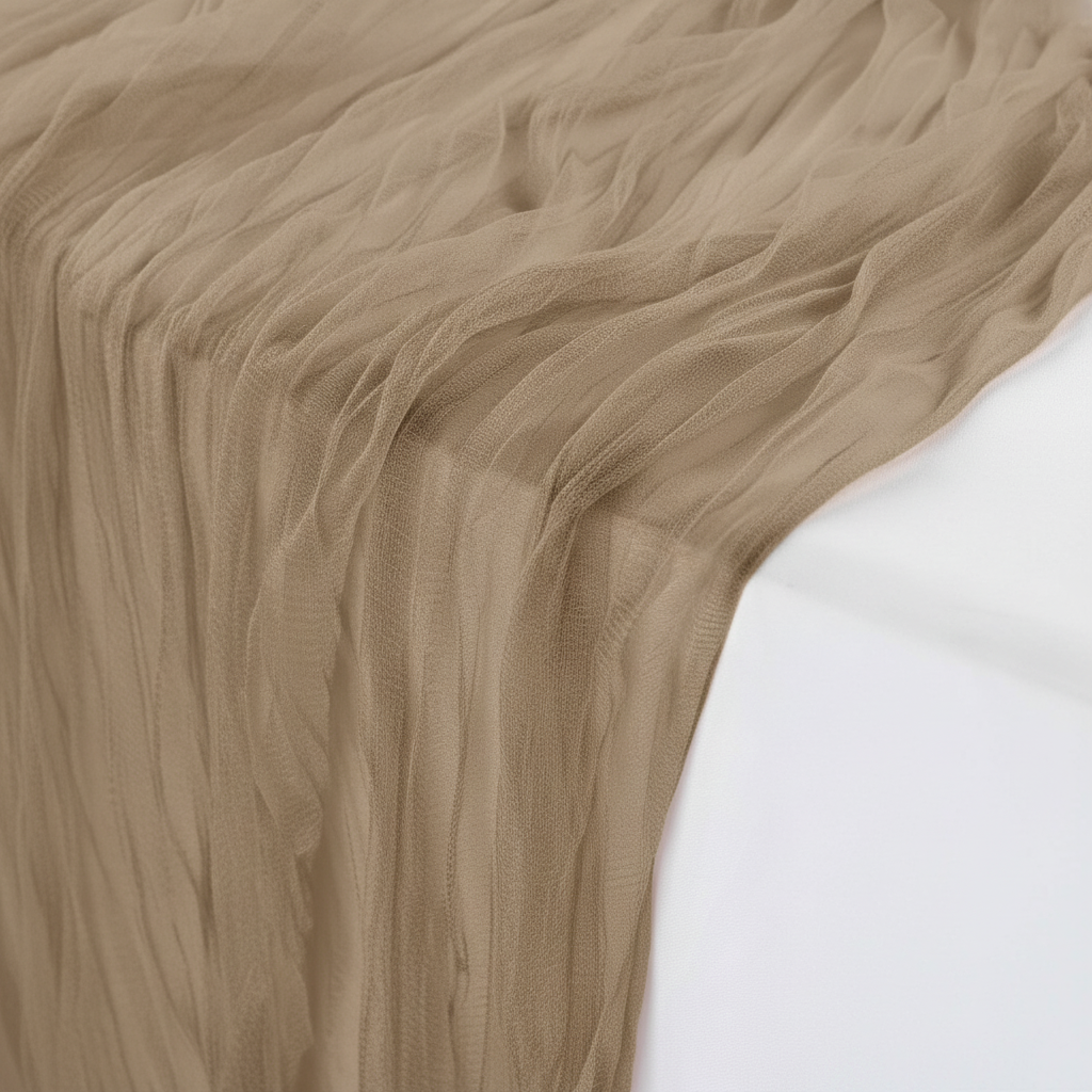 Close-up of the sheer semi-transparent crinkled coffee gauze weave and warm taupe color