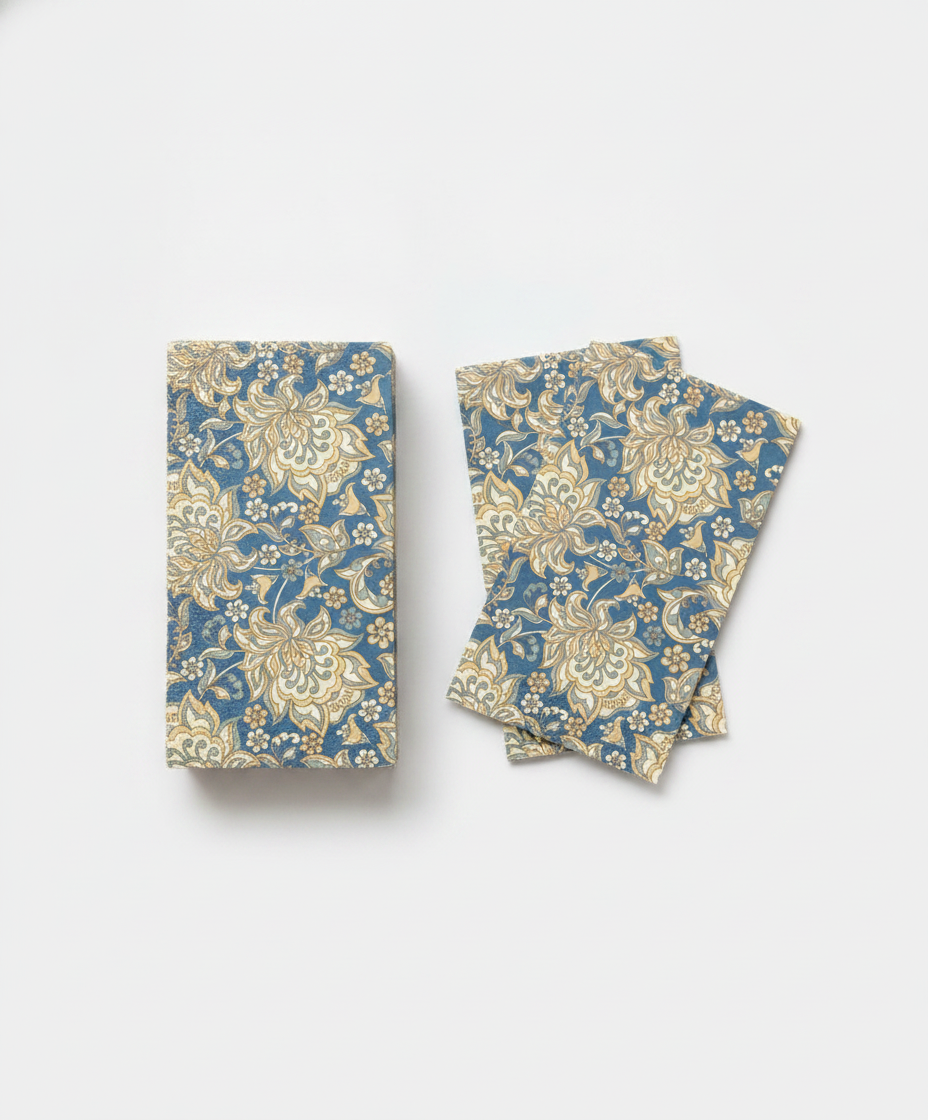 Stack of rectangular heritage English floral paper guest napkins fanned on a white background