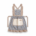 Blue floral kitchen apron with cream terry hand-wiping pocket on white background