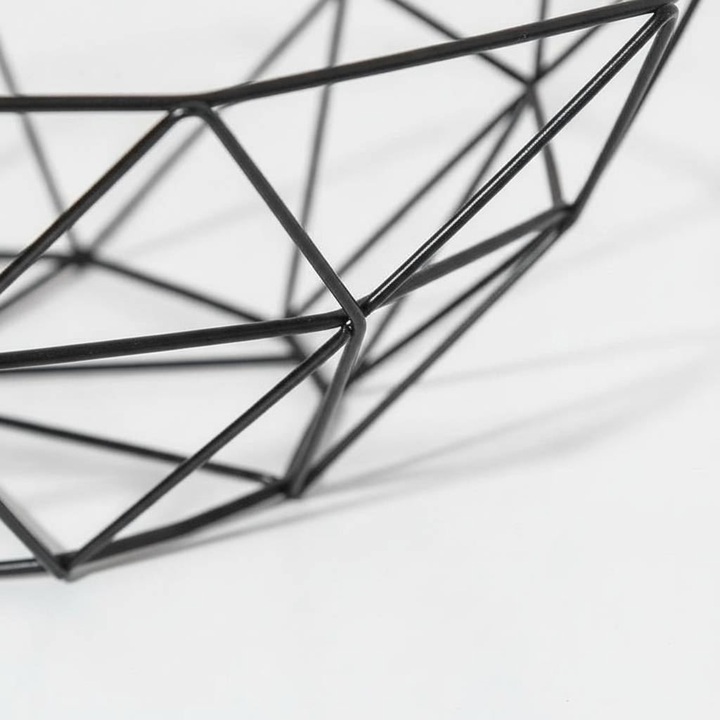Close-up of the welded black iron wire facets of the fruit basket
