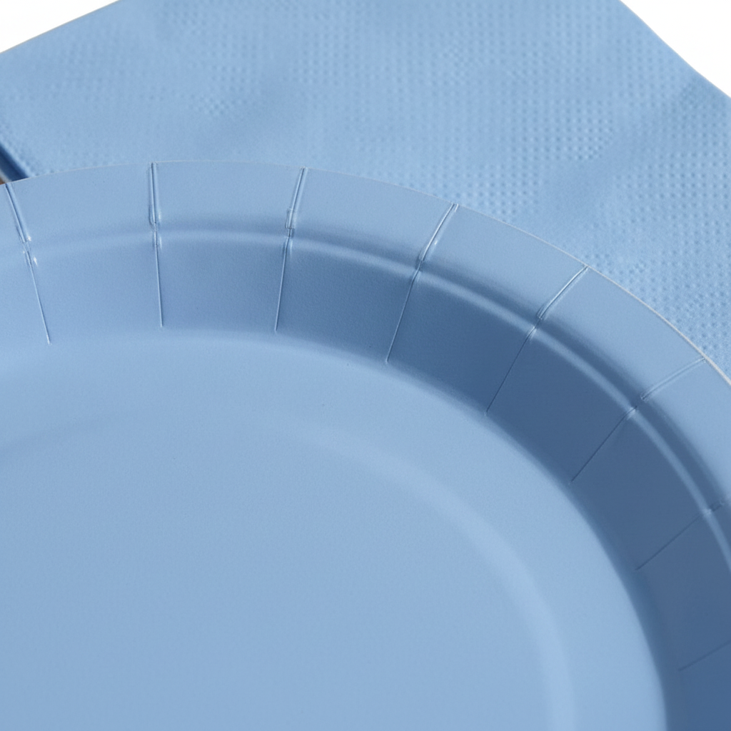 Macro close-up of matte baby blue paper plate rim and folded napkin