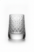 Girevole hand-cut crystal whiskey tumbler on white background