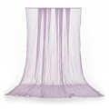 Lilac lavender gauze cheesecloth table runner draped on a white background showing its sheer crinkled texture