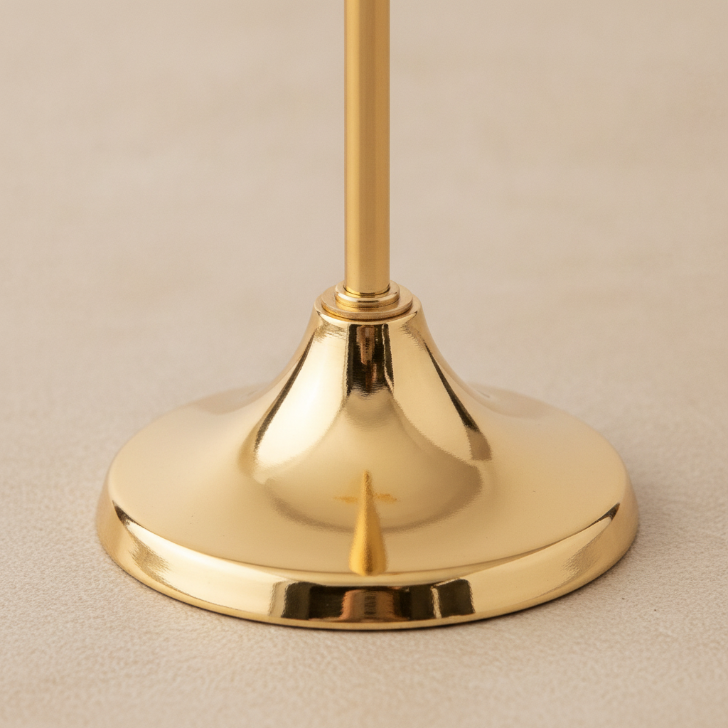 Close-up of the smooth flared trumpet base in mirror-polished gold