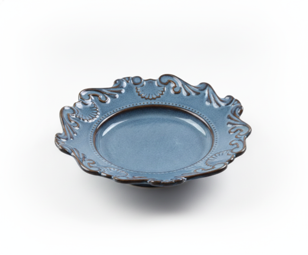 Baroque blue-grey porcelain bowl with ornate scalloped rim on white background