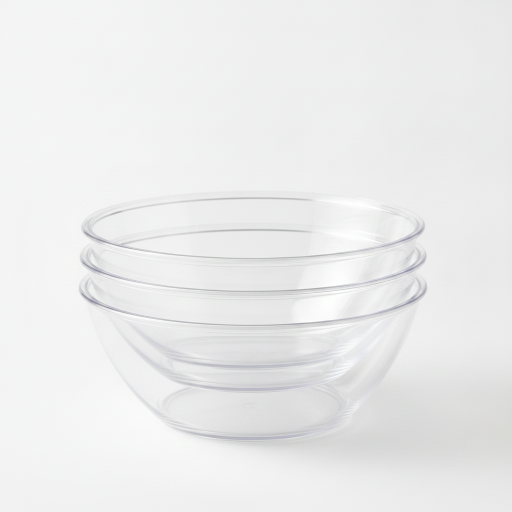 Close-up of clear plastic serving bowls nested and stacked together
