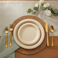 Natural tan compostable sugarcane bagasse disposable paper party plates styled tablescape with rattan placemat and gold flatware