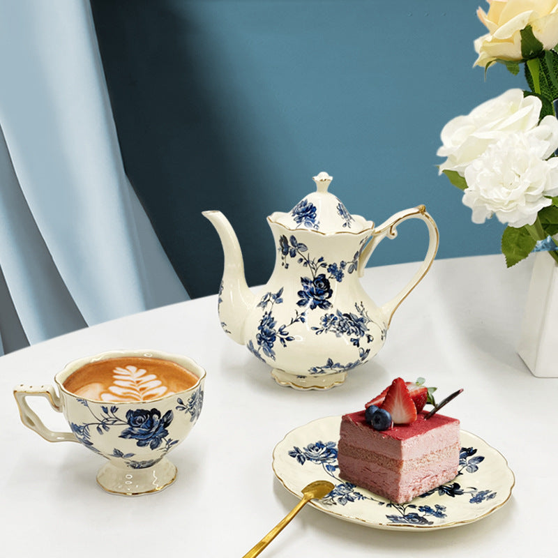 Close-up of gold-trimmed porcelain tea cup and saucer from English-style retro tea set