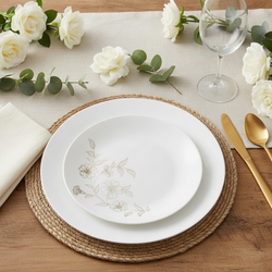 White disposable plastic plates with gold floral design styled fine-dining place setting